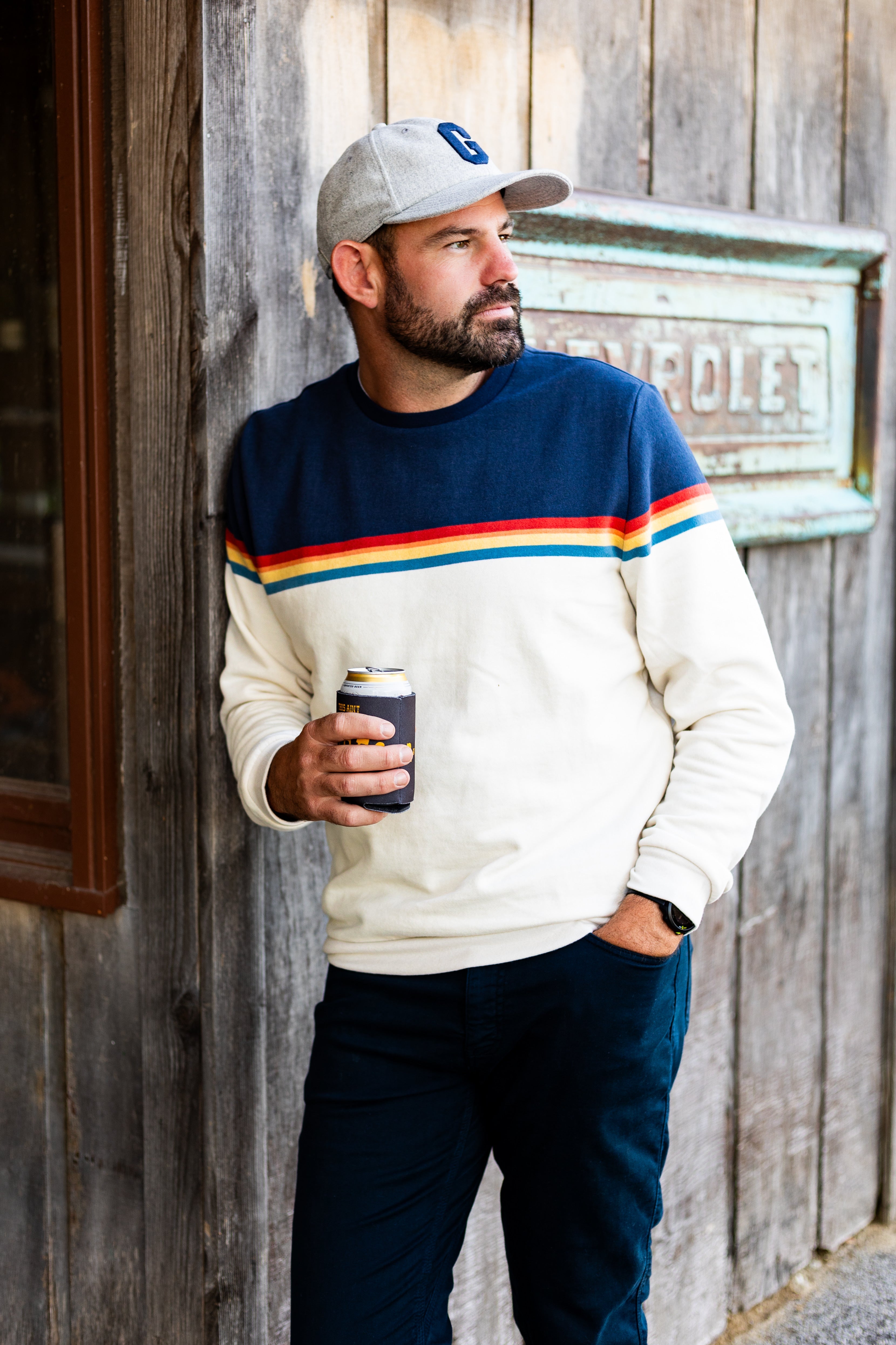 Model wearing Marine layer sunset stripe sweater