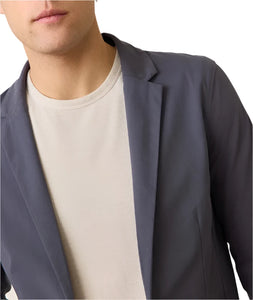 Model wearing Marine Layer Breeze Blazer in India Ink color, Front close up detail  view