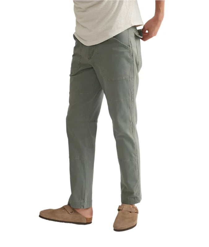 Model weraing Marine Layer Breyer Relaxed fit utility pant in vetiver (Green) color, front  view