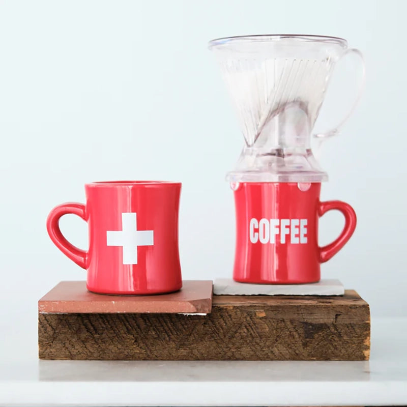 Red coffee mug with matte silver printed word, coffee