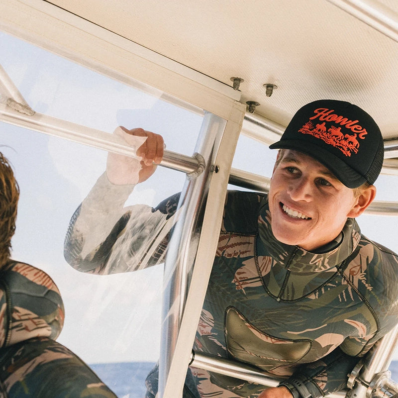 Model wearing Howler Brother's Foam Dome, howler posse hat in Black, Front view