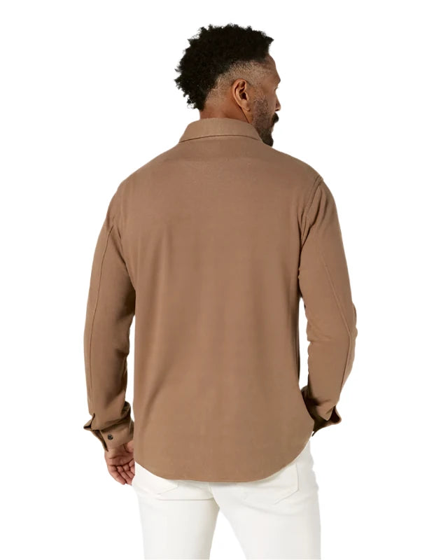 Model wearing 7 diamonds generation long sleeve shirt in cedar color, rear view