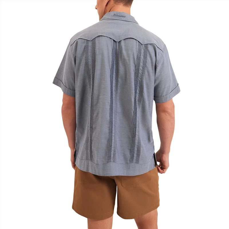 Model Wearing Howler Brothers Guayabera Shirt in Indigo Blue , rear  view