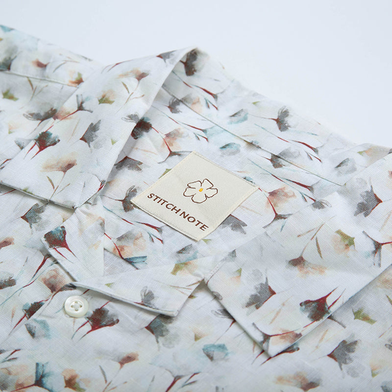 Stitch Note White Flower Linen shirt, flat lay close up fabric detail view