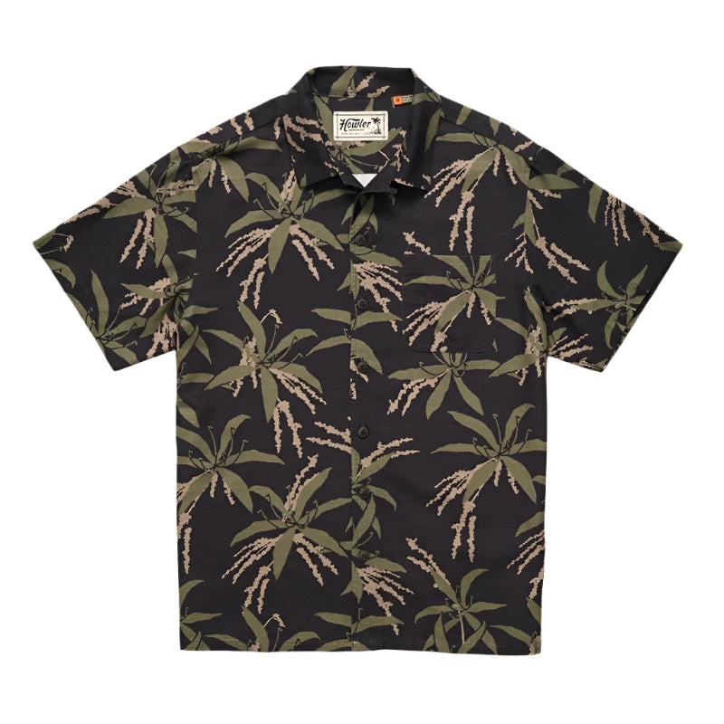 Howler Brother's Momoloha Shirt, lily negatives pattern, black with green, flat lay view