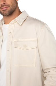 Model wearing Liverpool overshirt in parchment color, front  close up detail view