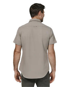 Model wearing Owen short sleeved stretch shirt in Clay color, rear view