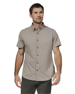 Model wearing Owen short sleeved stretch shirt in Clay color, front view