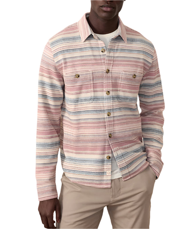 Model wearing Marine Layer Pacifica Stretch Twill Shirt in warm Baja stripe, front view