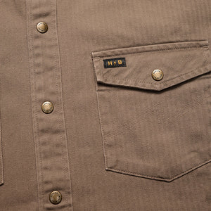 Howler Brothers Sawhorse work shirt in taupe, front view, close up fabric detail