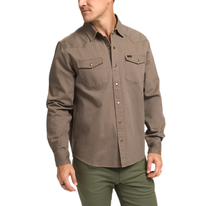 Model wearing Howler Brothers Sawhorse work shirt in taupe, front view