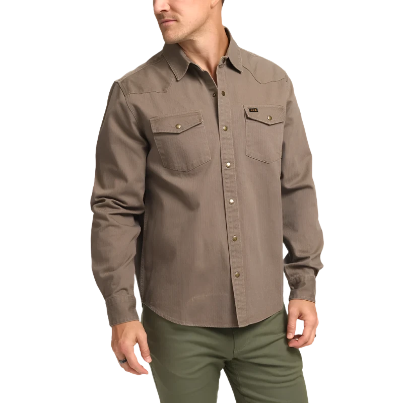 Model wearing Howler Brothers Sawhorse work shirt in taupe, front view