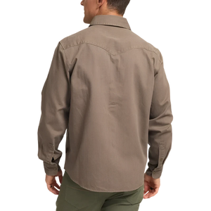 Model Wearing Howler Brothers Sawhorse work shirt in taupe, rear view