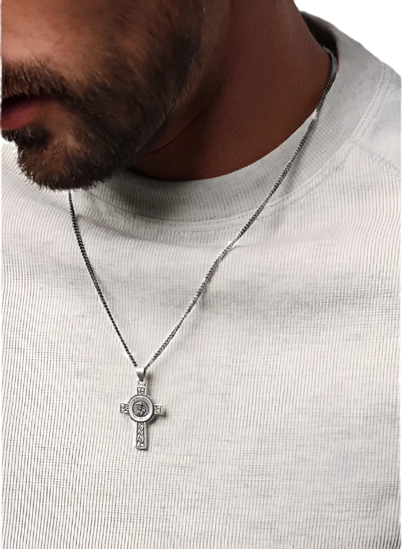 Model wearing St. Michael Cross pendant Necklace.