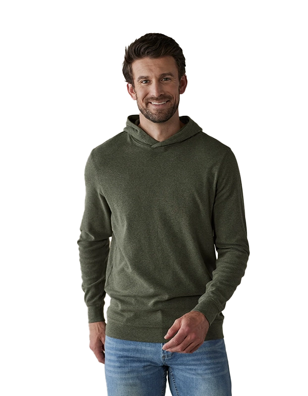 Model wearing The Normal Brand Essential Hoodie in Oakmoss, front view