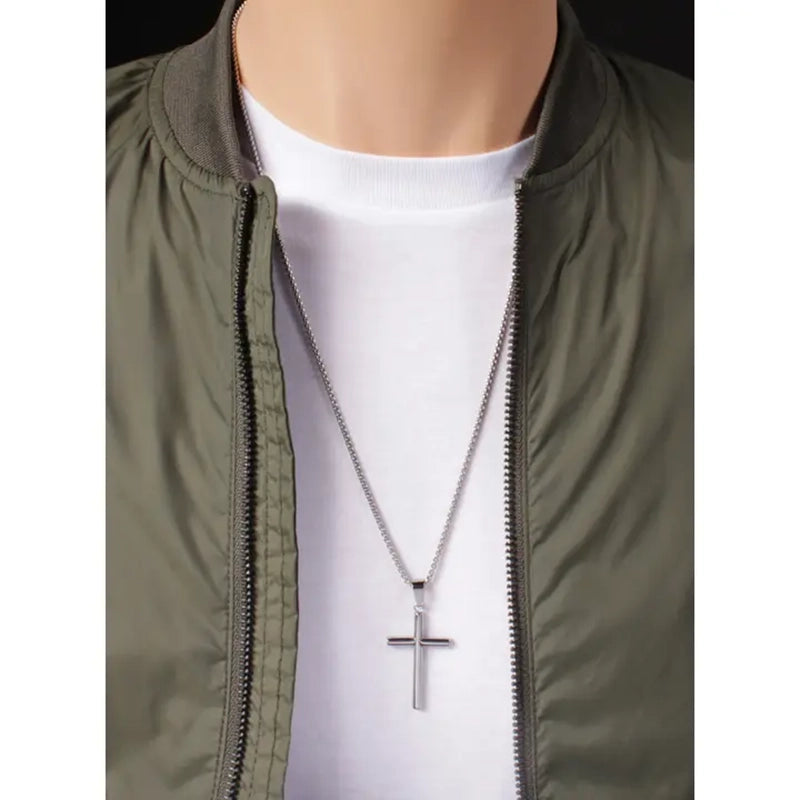 model wearing large cross pendant necklace