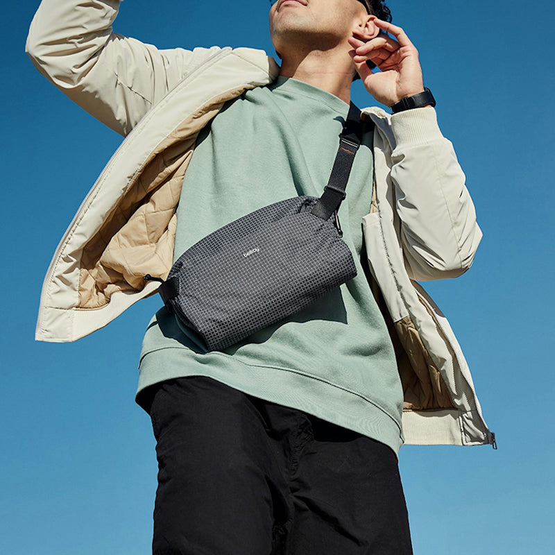 Model displaying Bellroy lite sling in arcade gray