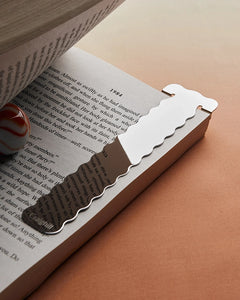 Craighill's Perch Bookmark shown in stainless on a book